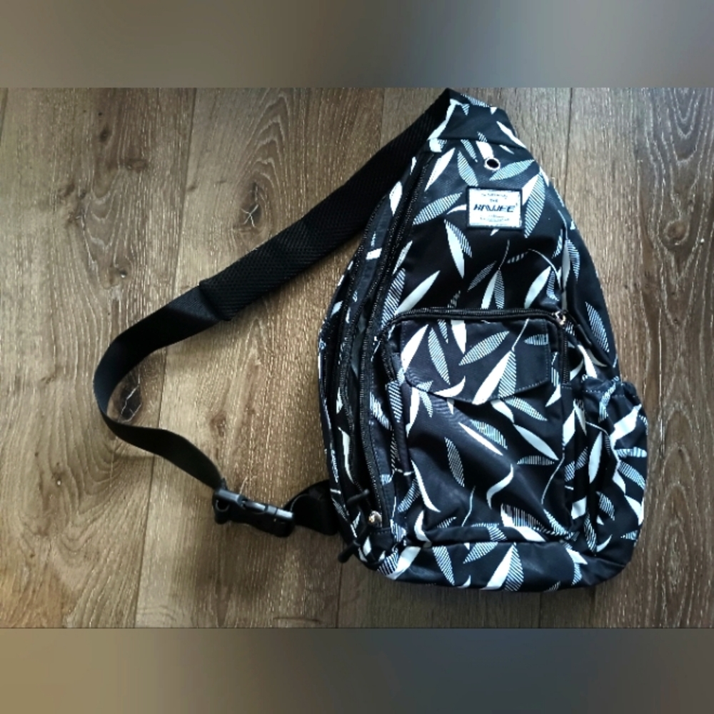 Sling backpack with tons of pockets